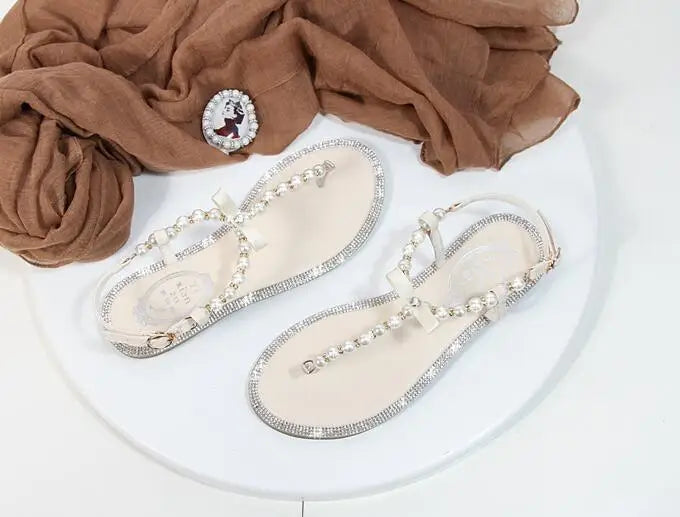 Shoes flat pearl sandals comfortable string bead beach slippers casualSPECIFICATIONSDepartment Name: ADULTBrand Name: Yue JabonModel Number: 11752Side Vamp Type: OpenBack Counter Type: Ankle StrapStyle: fashionFashion Element: String BDMEwomenstorenull