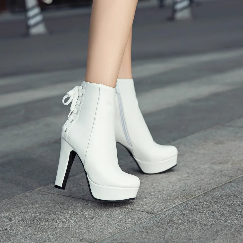 Fashion Ankle Boots Women Platform High Heels Short Boot Lace-up BlackSPECIFICATIONSBrand Name: ZOGEERBoot Type: basicShaft Material: PUOutsole Material: RUBBERUpper Material: PUHign-concerned Chemical: NoneOrigin: Mainland ChinaCN: SiDMEwomenstorenull