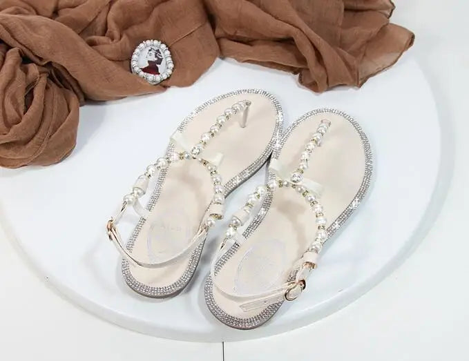 Shoes flat pearl sandals comfortable string bead beach slippers casualSPECIFICATIONSDepartment Name: ADULTBrand Name: Yue JabonModel Number: 11752Side Vamp Type: OpenBack Counter Type: Ankle StrapStyle: fashionFashion Element: String BDMEwomenstorenull