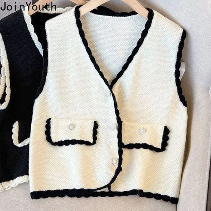 Vest Sweater Women Clothing V-neck Ruffles Single Breasted Vintage WaiSPECIFICATIONSBrand Name: JoinYouthStyle: vintageAge: JUNIOROrigin: Mainland ChinaCN: AnhuiSeason: Autumn/WinterThickness: StandardDecoration: ButtonMaterial: POLYESDMEwomenstorenull