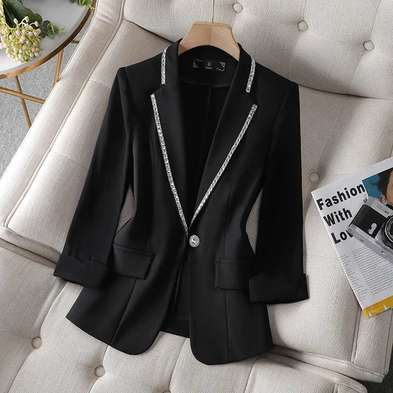 Women's slim-fit blazer with sequins, single button, and notched collar; ideal summer sunscreen jacket in a high street style.