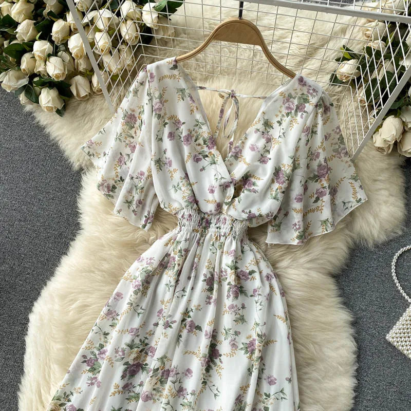 Floral Print Ruffle Chiffon Elegant Midi Dress A-line V Neck Beach VacSPECIFICATIONSBrand Name: unidanceElasticity: Non StrechSleeve Style: regularFabric Type: POLYESTERHign-concerned Chemical: NonePattern Type: PrintFit Type: SlimSilhDMEwomenstorenull