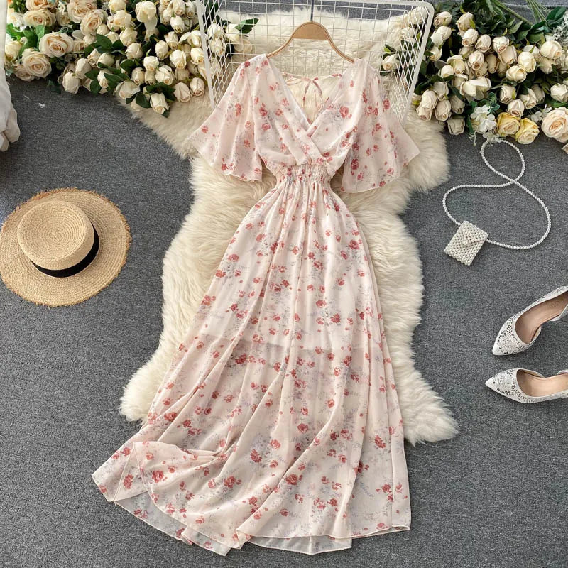 Floral Print Ruffle Chiffon Elegant Midi Dress A-line V Neck Beach VacSPECIFICATIONSBrand Name: unidanceElasticity: Non StrechSleeve Style: regularFabric Type: POLYESTERHign-concerned Chemical: NonePattern Type: PrintFit Type: SlimSilhDMEwomenstorenull