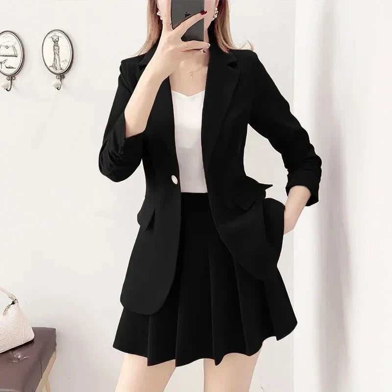 Elegant two-piece black blazer and A-line skirt suit for women.