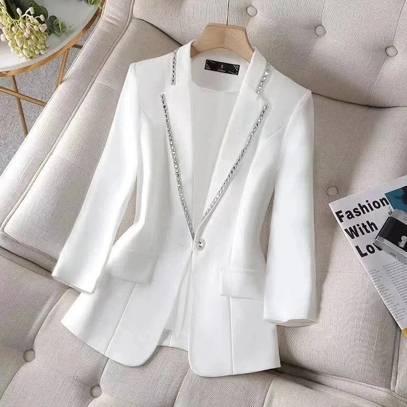 White women's blazer with sequins, single button closure, and slim fit; ideal for summer.