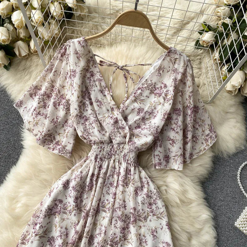 Floral Print Ruffle Chiffon Elegant Midi Dress A-line V Neck Beach VacSPECIFICATIONSBrand Name: unidanceElasticity: Non StrechSleeve Style: regularFabric Type: POLYESTERHign-concerned Chemical: NonePattern Type: PrintFit Type: SlimSilhDMEwomenstorenull