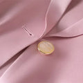 Pink slim waist jacket blazer with button detail and notched collar.