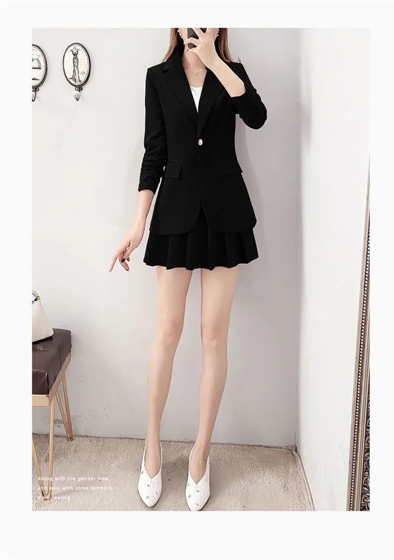 Elegant black blazer and A-line skirt suit for women, featuring a single button closure and ruffle details.