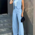 Women's blue blazer pant set with notched sleeveless blazer and high-waist pants.