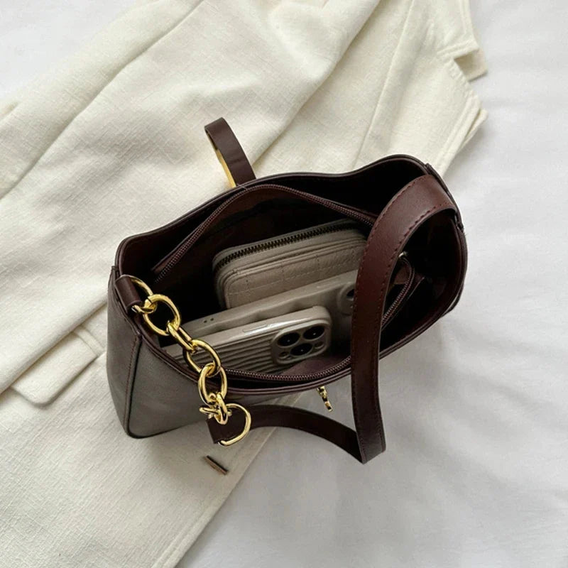 Top Quality Luxury Brand Purses and Handbags Designer Leather ShoulderSPECIFICATIONSBrand Name: YogodlnsHign-concerned Chemical: NoneHandbags Type: Shoulder BagsTypes of bags: Shoulder &amp; HandbagsMain Material: PULining Material: PODMEwomenstorenull