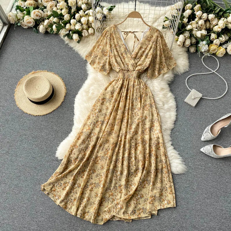 Floral Print Ruffle Chiffon Elegant Midi Dress A-line V Neck Beach VacSPECIFICATIONSBrand Name: unidanceElasticity: Non StrechSleeve Style: regularFabric Type: POLYESTERHign-concerned Chemical: NonePattern Type: PrintFit Type: SlimSilhDMEwomenstorenull