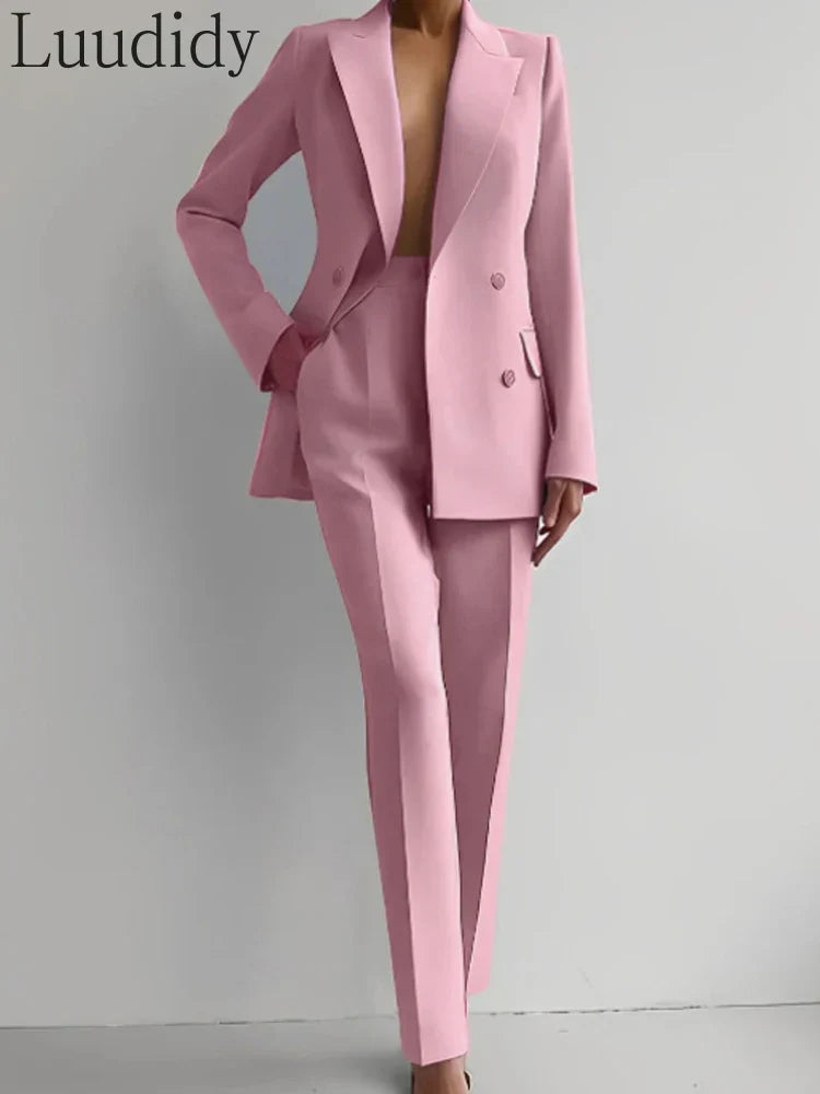 Women's two piece suit with long sleeve blazer and pencil pants in solid color.