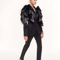 Women's slim black blazer coat with ruffles and shawl collar.