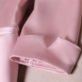 Slim waist jacket blazer with cropped sleeve detail in pink fabric.