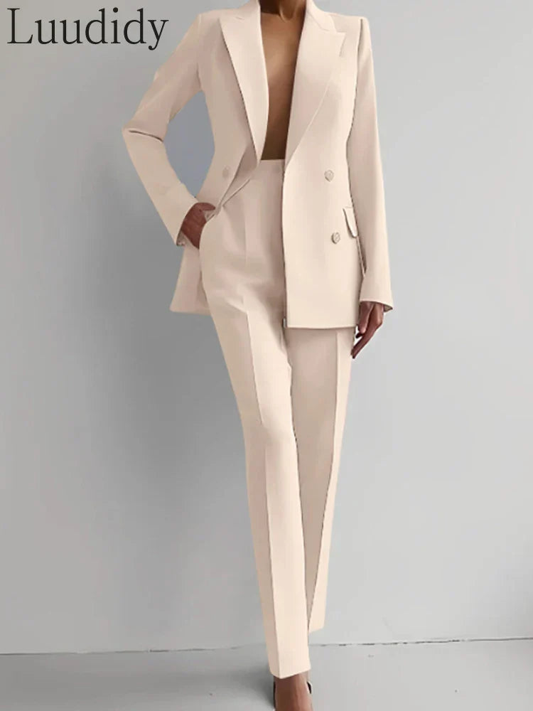 Two piece women's blazer suit with long sleeves and straight-fit pencil pants.