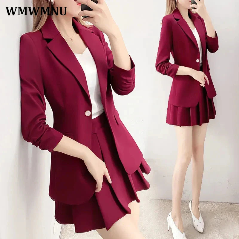 Elegant burgundy blazer and A-line skirt suit for women, featuring a single-button closure and notched collar.