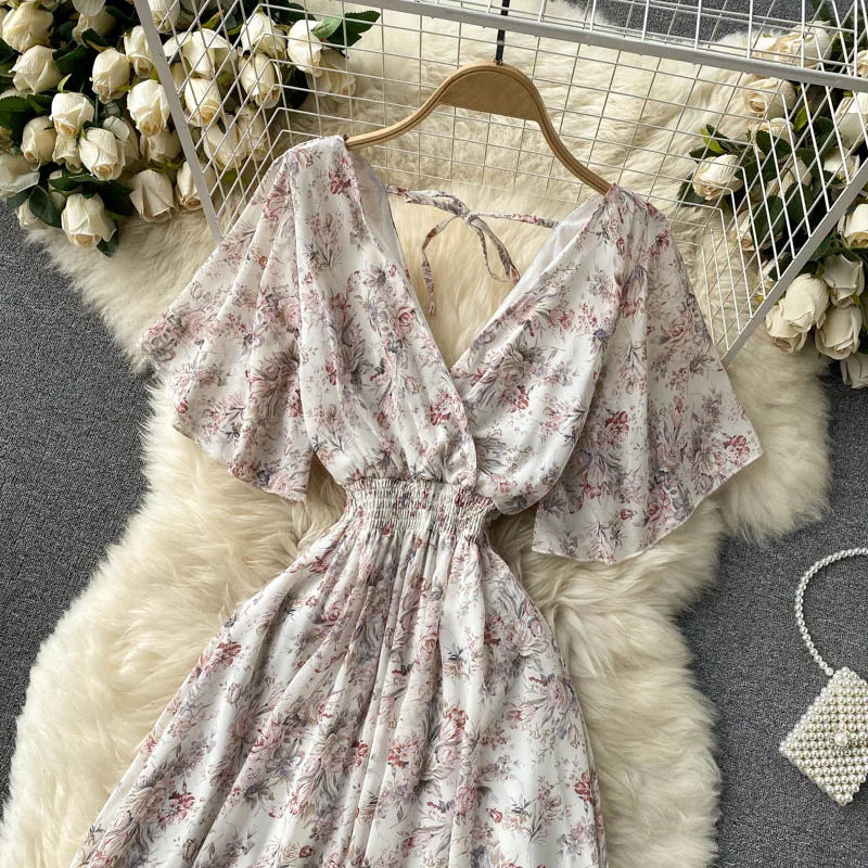 Floral Print Ruffle Chiffon Elegant Midi Dress A-line V Neck Beach VacSPECIFICATIONSBrand Name: unidanceElasticity: Non StrechSleeve Style: regularFabric Type: POLYESTERHign-concerned Chemical: NonePattern Type: PrintFit Type: SlimSilhDMEwomenstorenull