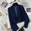 Women's solid color short suit jacket with notched collar and single button closure.