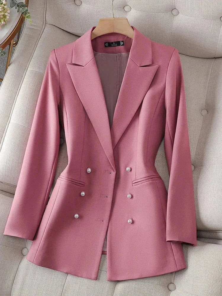 Women's long sleeve triple-breasted pink blazer with notched collar.