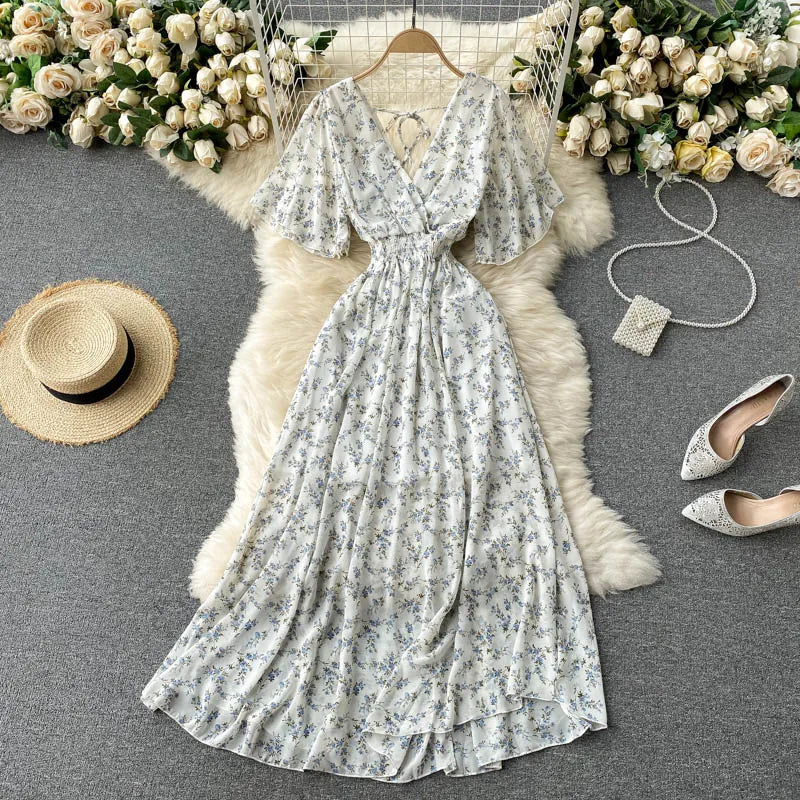 Floral Print Ruffle Chiffon Elegant Midi Dress A-line V Neck Beach VacSPECIFICATIONSBrand Name: unidanceElasticity: Non StrechSleeve Style: regularFabric Type: POLYESTERHign-concerned Chemical: NonePattern Type: PrintFit Type: SlimSilhDMEwomenstorenull