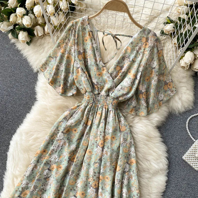 Floral Print Ruffle Chiffon Elegant Midi Dress A-line V Neck Beach VacSPECIFICATIONSBrand Name: unidanceElasticity: Non StrechSleeve Style: regularFabric Type: POLYESTERHign-concerned Chemical: NonePattern Type: PrintFit Type: SlimSilhDMEwomenstorenull