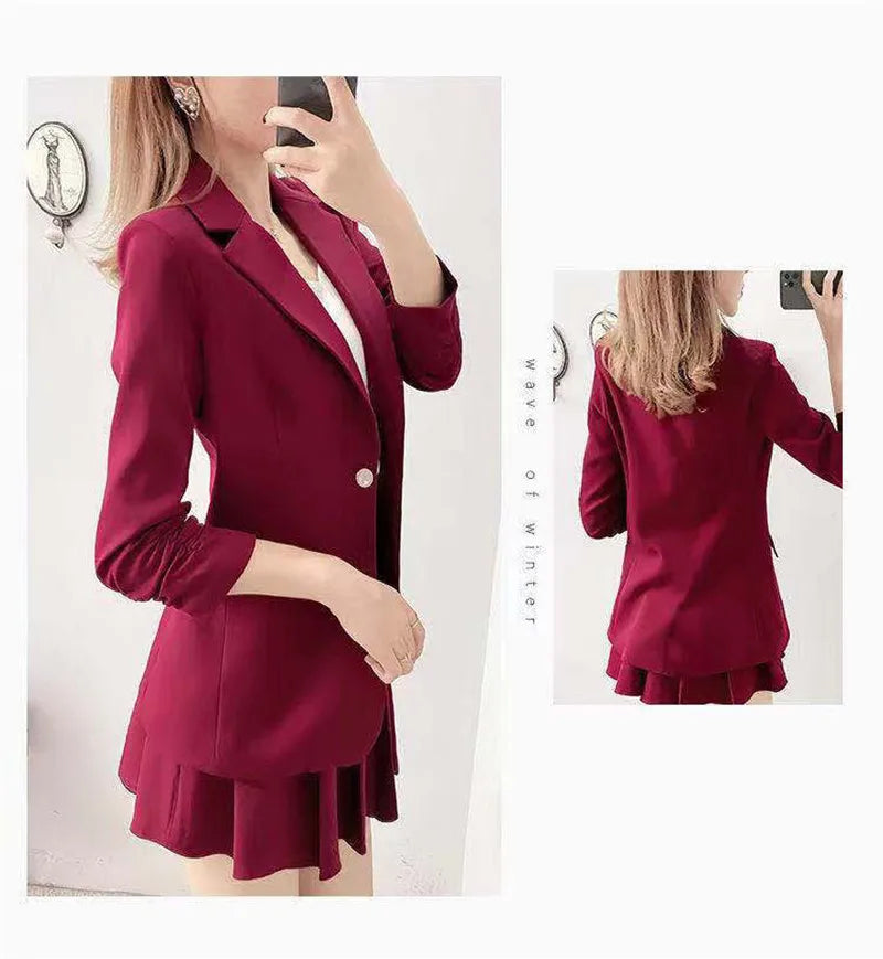 Women's elegant 2-piece blazer and A-line skirt suit in deep red.