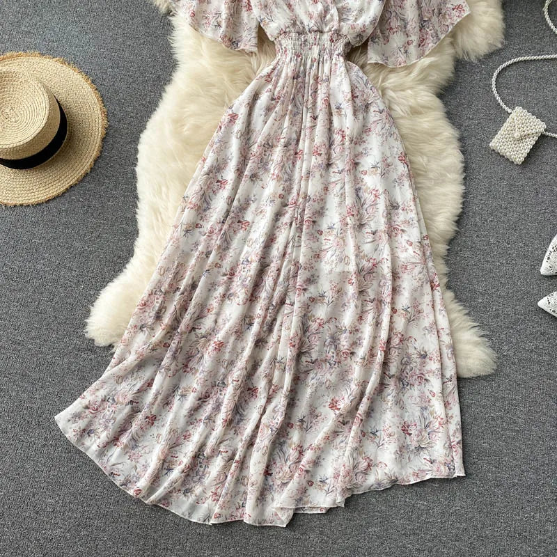 Floral Print Ruffle Chiffon Elegant Midi Dress A-line V Neck Beach VacSPECIFICATIONSBrand Name: unidanceElasticity: Non StrechSleeve Style: regularFabric Type: POLYESTERHign-concerned Chemical: NonePattern Type: PrintFit Type: SlimSilhDMEwomenstorenull