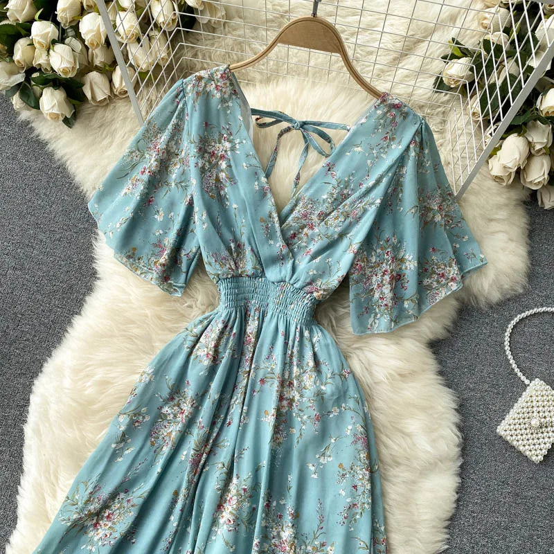 Floral Print Ruffle Chiffon Elegant Midi Dress A-line V Neck Beach VacSPECIFICATIONSBrand Name: unidanceElasticity: Non StrechSleeve Style: regularFabric Type: POLYESTERHign-concerned Chemical: NonePattern Type: PrintFit Type: SlimSilhDMEwomenstorenull