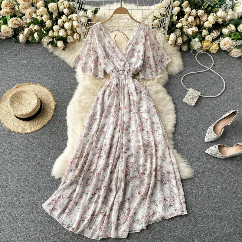 Floral Print Ruffle Chiffon Elegant Midi Dress A-line V Neck Beach VacSPECIFICATIONSBrand Name: unidanceElasticity: Non StrechSleeve Style: regularFabric Type: POLYESTERHign-concerned Chemical: NonePattern Type: PrintFit Type: SlimSilhDMEwomenstorenull