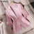 Women's slim waist pink blazer with cropped sleeves and single breasted closure, summer office style.