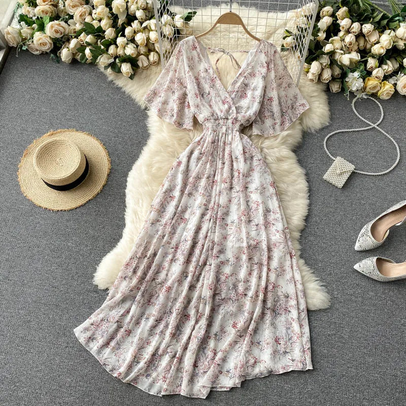 Floral Print Ruffle Chiffon Elegant Midi Dress A-line V Neck Beach VacSPECIFICATIONSBrand Name: unidanceElasticity: Non StrechSleeve Style: regularFabric Type: POLYESTERHign-concerned Chemical: NonePattern Type: PrintFit Type: SlimSilhDMEwomenstorenull