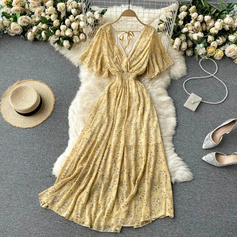 Floral Print Ruffle Chiffon Elegant Midi Dress A-line V Neck Beach VacSPECIFICATIONSBrand Name: unidanceElasticity: Non StrechSleeve Style: regularFabric Type: POLYESTERHign-concerned Chemical: NonePattern Type: PrintFit Type: SlimSilhDMEwomenstorenull