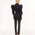 Ladies slim black blazer coat with ruffled detailing, long sleeves, single button closure.