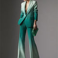 Gradient green slim fitting women's suit set with notched collar blazer and flare pants.