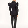 Ladies black slim blazer coat with ruffle sleeves, shawl collar, and single button closure.