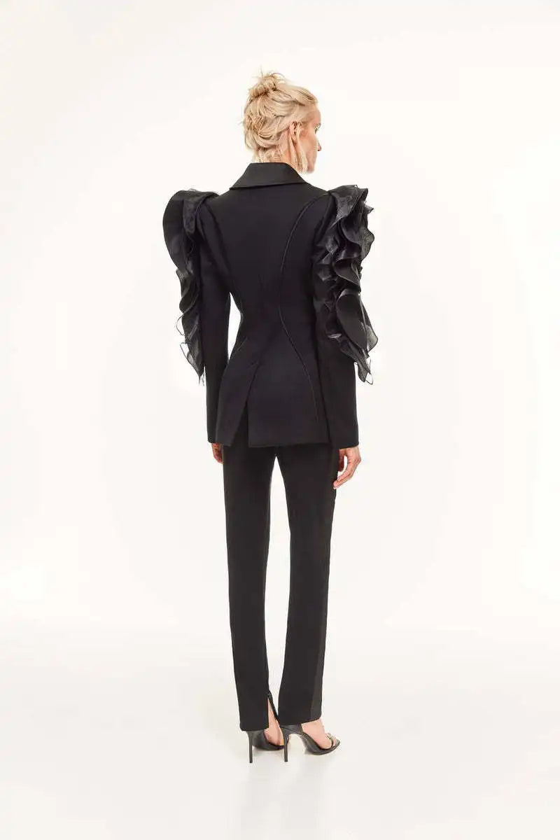 Ladies black slim blazer coat with ruffle sleeves, shawl collar, and single button closure.