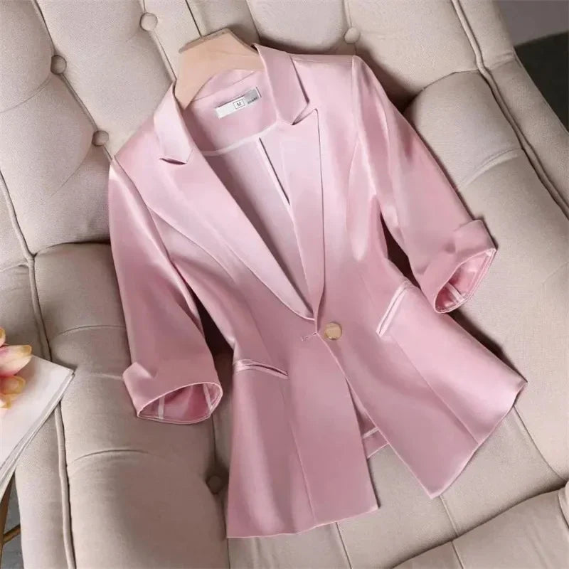 Slim pink women's jacket blazer with cropped sleeves, single-breasted closure, and notched collar, perfect for summer office wear.