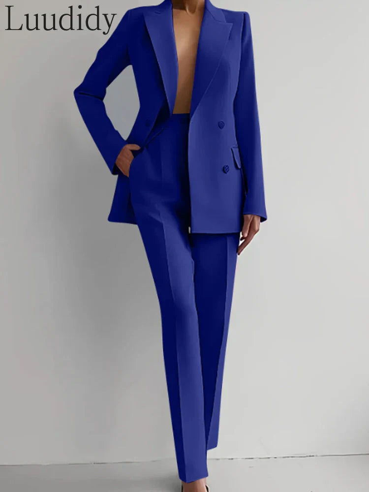 Two piece women's blazer suit with long sleeves and pencil pants, double-breasted, office lady style in solid color.